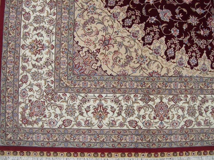 white border of silk and wool rug
