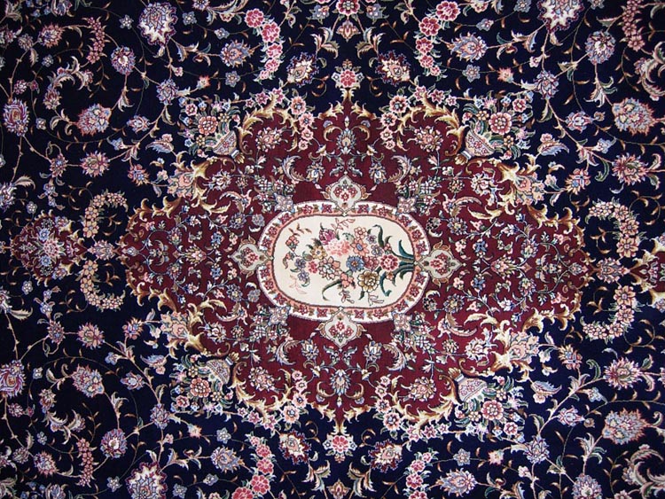 central medallion of silk cand wool carpet