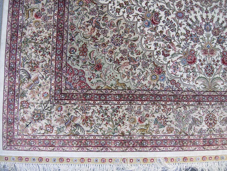 the corner of hand-made oriental silk rug