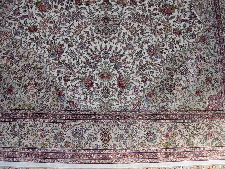 the field of oriental hand-made silk rug