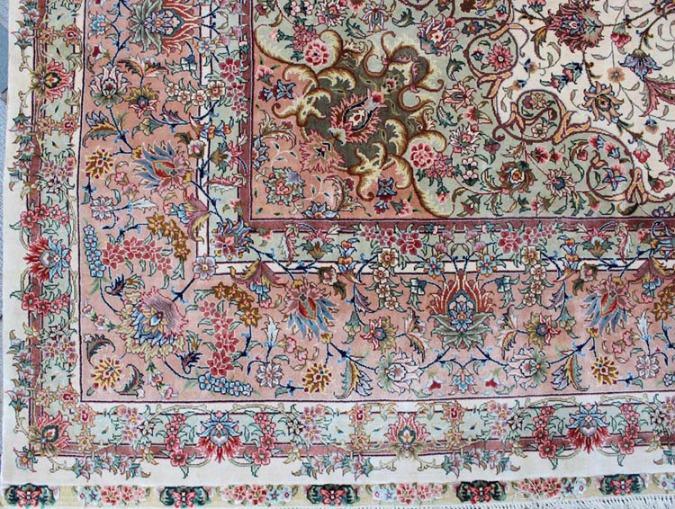 the corner of hand-made oriental silk carpet